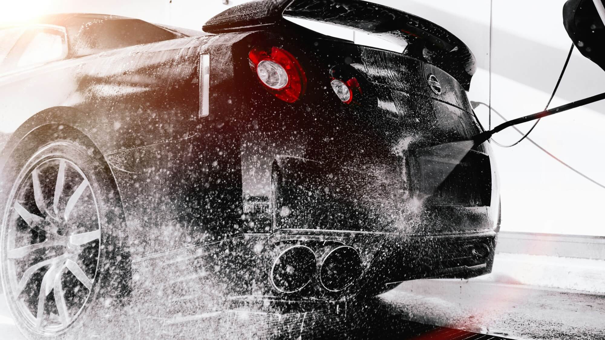 A Nissan GTR being washed and cleaned at a valet servicing